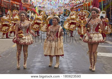 ORURO, BOLIVIA - FEBRUARY 26, 2017: Morenada dance group in colourful outfits parading through the mining city of Oruro on the Altiplano of Bolivia during the annual Oruro Carnival.
