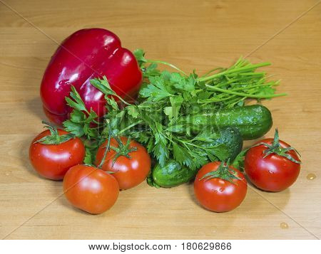 The fresh vegetables on the wooden table