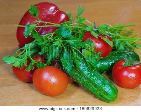 The tomatoes cucumbers bell peppers and greens