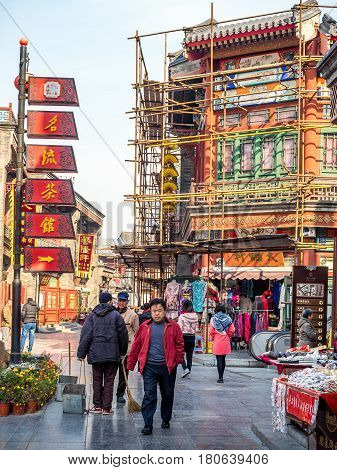 Tianjin, China - Nov 1, 2016: Tianjin Ancient Cultural Street; shop buildings preserved in the classical Qing Dynasty architectural style. Morning scene to what is a very popular tourist area.