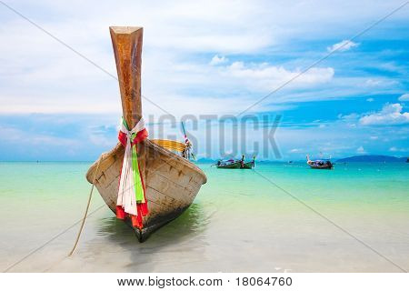Longtail boats moored off the shore in Krabi, west coast of Thailand