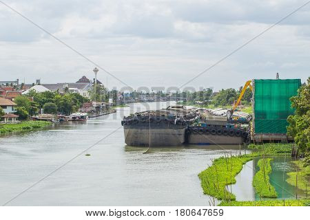 River in Thailand with Boat Big barge carry sand.