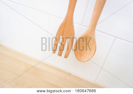 Kitchen decoration Wood spoon and folk in clean new home cuisine.