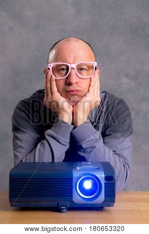 Young Man With Projektor Watch Boring Film