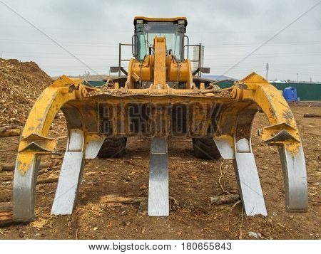 Timber loader on the loading dock closeup. Front view