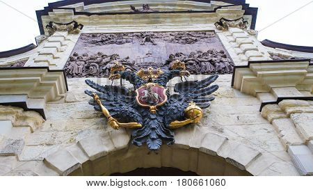 Two-headed eagle a symbol of Russia on the ancient wall of the church a horizontal photo. Saint-Petersburg Russia. 18 September 2016