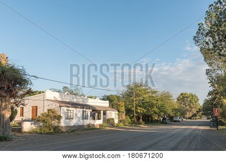NIEU BETHESDA SOUTH AFRICA - MARCH 22 2017: Early morning street scene at the Owl House visitor centre in Nieu-Bethesda an historic village in the Eastern Cape Province