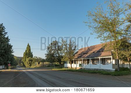 NIEU BETHESDA SOUTH AFRICA - MARCH 22 2017: An early morning street scene with the old parsonage of the Dutch Reformed Church in Nieu-Bethesda an historic village in the Eastern Cape Province