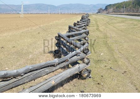 Traditional Zigzag Fence Protecting A Pasture In Buryatia. Tunkinskaya Valley
