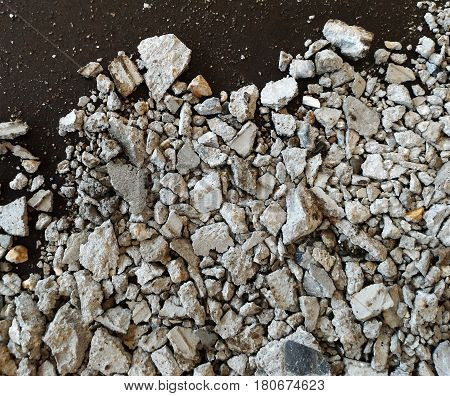 scrap stone and scap cement on dirty ground