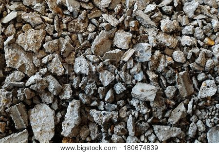 scrap stone and scap cement on dirty ground
