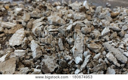 scrap stone and scap cement on dirty ground