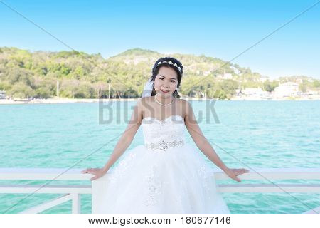 Photos Fashion Wedding Dress of Asian women at Si Chang Island Chonburi ProvinceThailandconcept of marriage and beauty.
