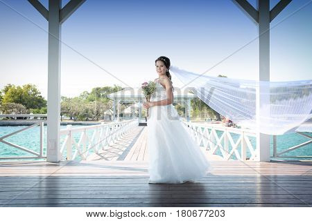 Photos Fashion Wedding Dress of Asian women at Si Chang Island Chonburi ProvinceThailandconcept of marriage and beauty.