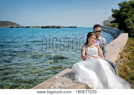 Pre Wedding photos of love couples in Thailandtourist attraction of Koh ChangAsadang Bridge in Chonburi province.