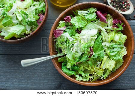 A Dish Of Fresh Salad Frisse, Romano And Radiccio With Olive Oil, Salt And Freshly Ground Percec In