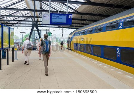 ROTTERDAM, THE NETHERLANDS - APRIL 16: Unknown travellers are entering and leaving an intercity train at the central station of Rotterdam on April 16, 2014 in the city of Rotterdam, the Netherlands