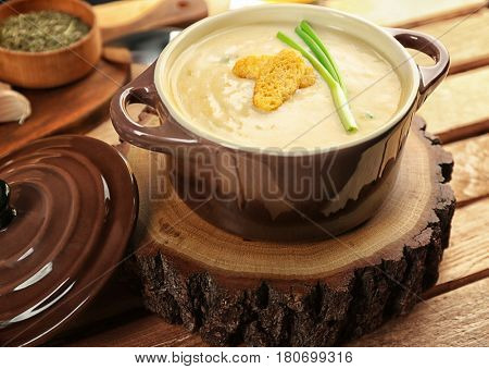 Delicious cream soup with bread, closeup