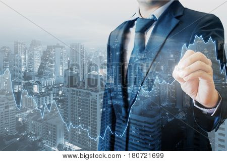 Double Exposure Of Professional Businessman Touch Financial Graph And City Of Business In Trading Bu