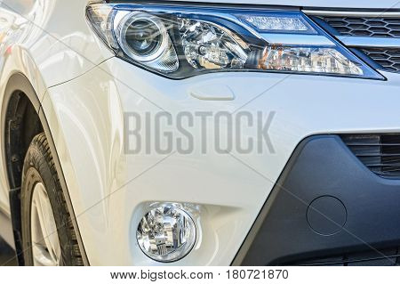 Closeup photograph of headlights of moderm new car.