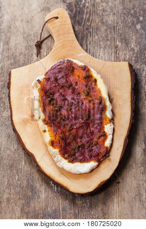 single Lahmacun a turkish pizza on wood