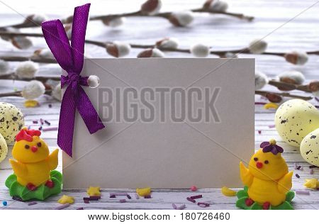 Easter Background With Yellow Easter Eggs Pussy Willow Branches Purple Ribbon And Little Chickens Sp