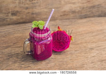 Smoothies Of A Red Organic Dragon Fruit On An Old Wooden Background