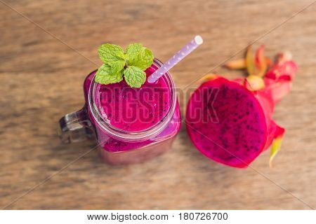 Smoothies Of A Red Organic Dragon Fruit On An Old Wooden Background