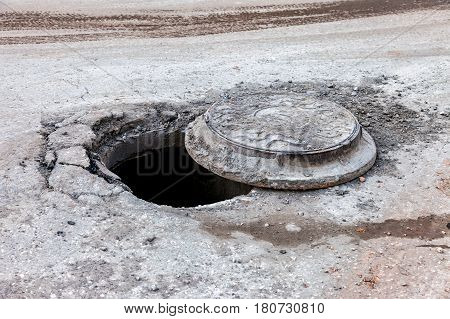 Open unsecured sewer manhole on the city street