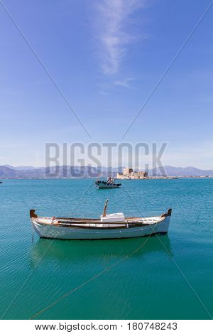 Fishing Boats And Bourtzi Fortress In Nafplion, Greece- Portrait Photo