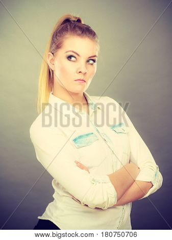 Angry Woman Looking Very Displeased Standing With Arms Folded