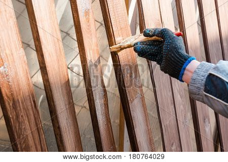 To Paint A Fence. The Man Paints A Fence.
