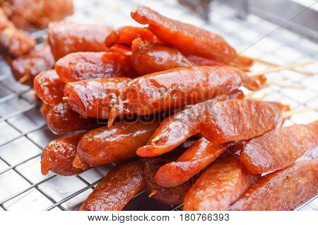 A pile of Grilled Chinese Sausage on the tray