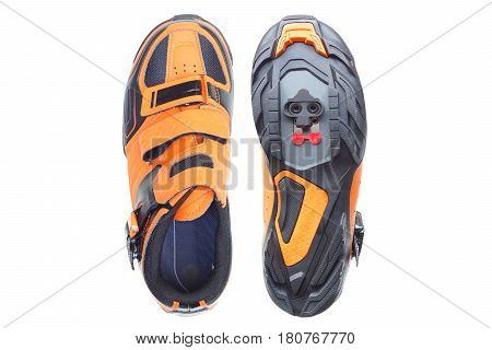 Mountain bike cycling shoes in orange color isolated