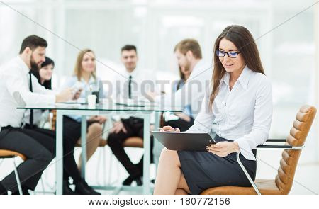 leading specialist company in the background of the business team. the photo has a empty space for your text.