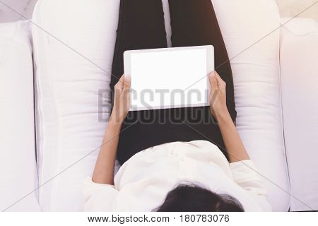 Close up Woman using tablet in coffee shop for summary of Business performance report or online marketting concept