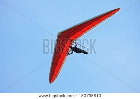 Hang Glider flying in a blue sky