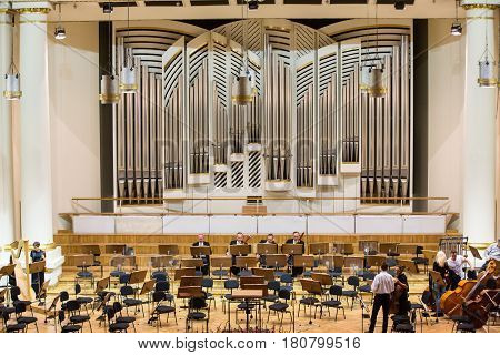 CRACOW POLAND - SEPTEMBER 25 2015: View of the stage of the concert hall at the Cracow Philharmonic with the new Orgelbau organ in the background. Cracow Poland