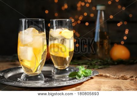Glasses with delicious wine spritzer on silver tray