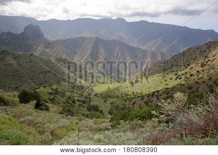 LA GOMERA, SPAIN: Mountainous and green landscape with terraced fields between Agulo and Vallehermoso
