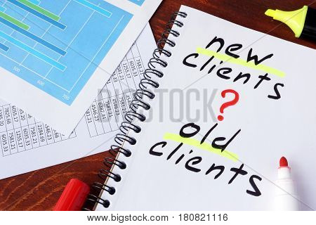 New clients or old clients written in a note. Customer Acquisition concept.
