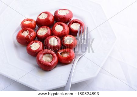 red peppers stuffed with cheese on plate