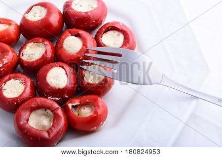 red peppers stuffed with cheese on plate