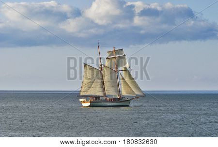 Big schooner and small cutter following it