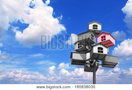 Many nesting boxes of gray color and single nesting box of pink color. On background with blue sky and white clouds