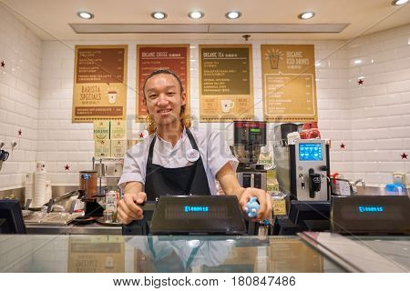 HONG KONG - CIRCA NOVEMBER, 2016: indoor portrait of a man at Pret a Manger in Hong Kong. Pret a Manger is a sandwich shop chain based in the United Kingdom.