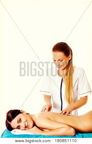 Woman having massage of body in the spa salon. Beauty treatment concept.
