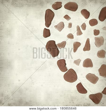 textured old paper background with heart symbol made of seaglass