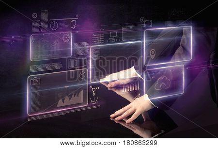 Male hands touching interactive table with purple cloudspace graphic on it 