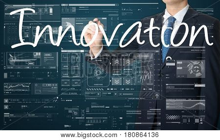 Businessman Writing Innovation And Drawing Graphs And Diagrams